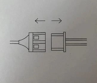 Retrait du module LED avant lavage du pull de Noël lumineux